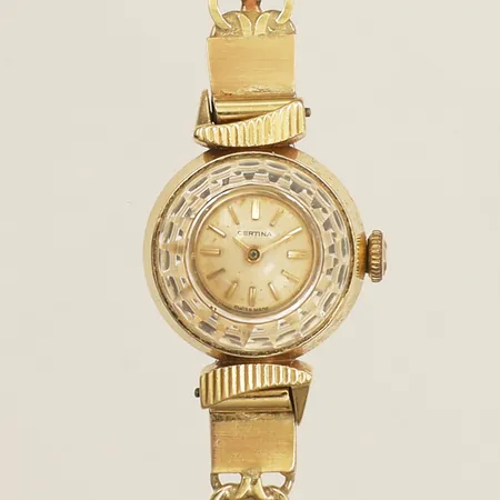 Damur Certina guld manuell Ø17mm armband i guld 17,5cm inklusive boetten 18K bruttovikt 19,6g på auktion i Farsta hos Pantbanken Sverige