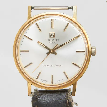 Herrur Tissot Seastar Seven Ø33,5mm, automatisk, personlig gravyr, defekt läderband, 18K bruttovikt 31,1g.