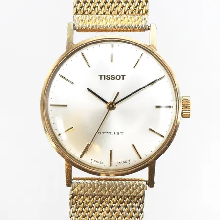 Herrur Tissot Stylist 14K, quartz, Ø33mm, längd inklusive ur 26cm, bredd 15,5mm, klockband i förgylld metall, gravyr, bruksslitage på ur och band, batteribyte krävs, ej funktionstestad, originalbox, slitage på box.