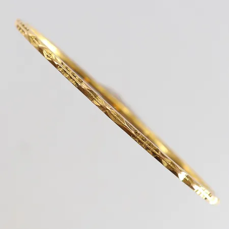 Armring med dekor Ø57,5mm bredd 2mm ostämplat 18K.  Vikt: 11 g