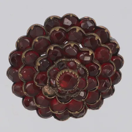 Brosch med röda stenar, Ø27,4mm, en sten saknas, metall