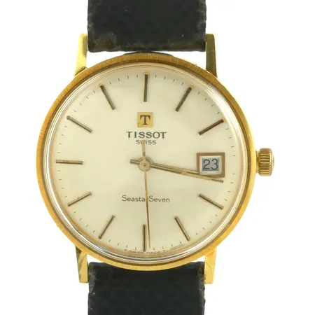 Herrur Tissot Seastar Seven, 18K guld, Ø34 mm, manuell - defekt urverk, lös krona, mindre intryckning bakboett, skinnband (slitage) och spänne original Vikt: 33,5 g