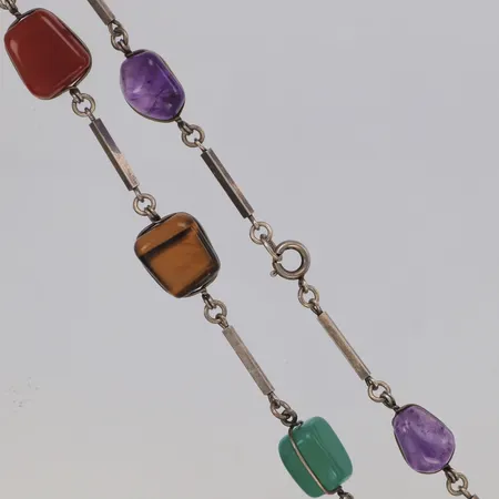Collier med tumlade stenar i olika färger, längd 60cm, bredd ca 13mm, importstämplat 835/1000 silver Vikt: 0 g