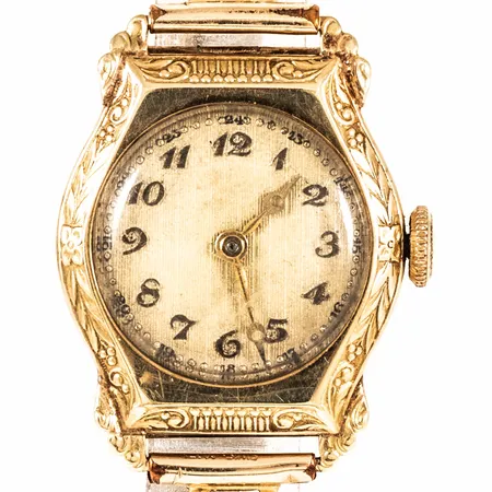 Damur guld 14K manuell 21mm plexiglas, flexband i metall, går ej, lös urtavla, repigt glas, bruttovikt 18,5g. 
