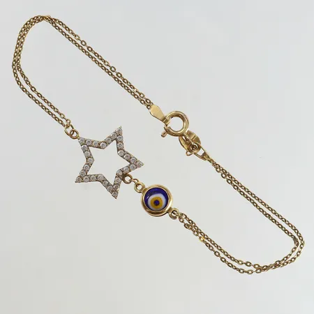 Armband med vita stenar samt öga längd 18cm bredd 1,6-17mm 14K.  Vikt: 3,3 g