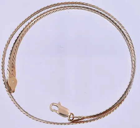 Collier längd 42,5 cm bredd 7 mm 18K. Vikt: 30,9 g
