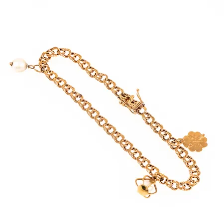 Armband Bismarck med tre berlocker längd 19,5cm bredd 4,5mm, bruksslitage, defekt säkerhetsåtta, 18K bruttovikt 8,5g. 