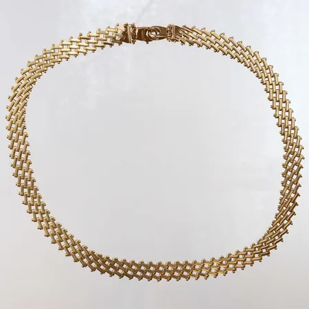 Collier längd 42,5cm bredd 12mm slitage 18K.  Vikt: 36,6 g