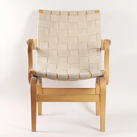 Fåtölj "Eva" Bruno Mathsson för DUX, bok och sadelgjord, höjd 83cm, bredd 59cm, djup 70cm, omkring år 2000, bruksslitage, missfärgningar. Specialfrakt, kontakta pantbankskontoret för mer information.