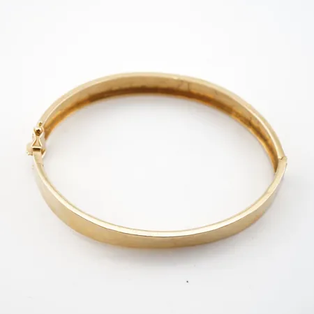 Armring, innermått 18cm, bredd 9mm, 18k Vikt: 15,3 g på auktion i Helsingborg hos Pantbanken Sverige