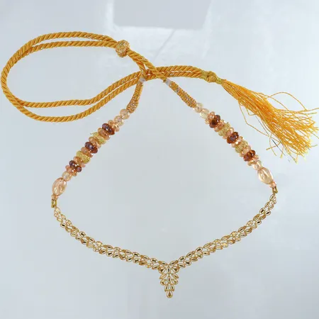 Collier med tråd och stenar del i 21K justerbar längd max ca 74cm 21K bruttovikt 17,8g Vikt: 17,8 g