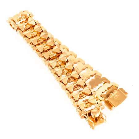Armband längd 19cm bredd 16mm, någon buckla, 18K 25,4g. 