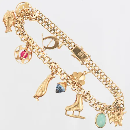 Armband X-länk med tio berlocker, längd 20,5cm, bredd 6-35mm, tre berlocker med stenar, 18K Vikt: 18,9 g
