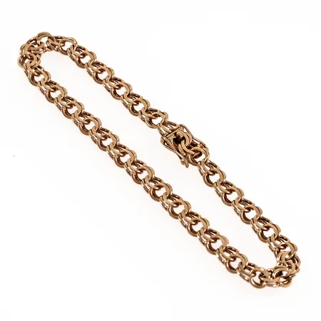 Armband Bismarck i 14K guld. Det är 20 cm långt, 6 mm brett och väger 9,8g. Kistlås. Nötta länkar mot låset.