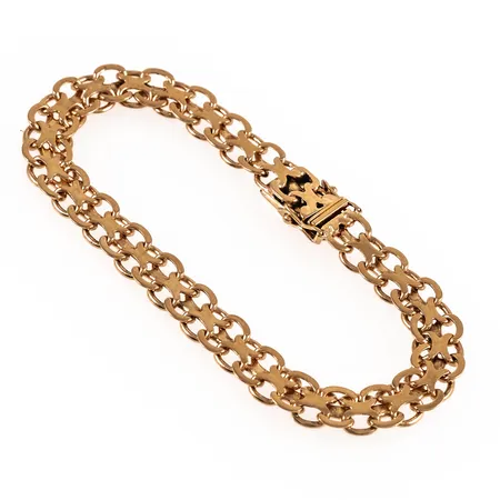 Armband X-länk i 18K guld. Det är 20 cm långt, 8 mm brett och väger 17,4g. Kistlås.