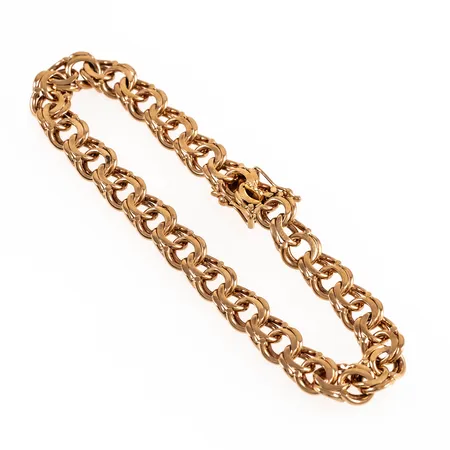 Armband Bismarck i 18K guld. Det är 19 cm långt, 7,5 mm brett och väger 20,6g. Kistlås.