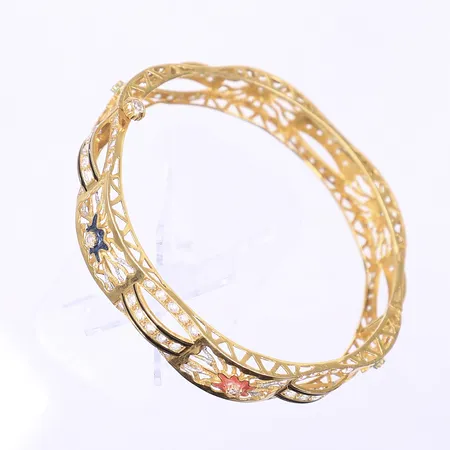 Armring öppningsbar med vita stenar samt emaljdetaljer Ø62mm bredd 12mm skruvlås något ojämn 21K Vikt: 23,1 g