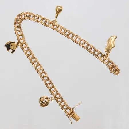 Armband, Bismarck med fyra integrerade berlocker, längd: 18,5cm, bredd: 6,1mm, svenska stämplar, 18K Vikt: 15,7 g