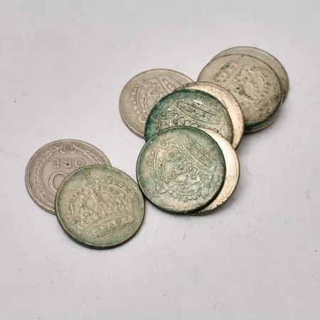 Mynt i silver, 11st 50öre, vikt 52,54g.