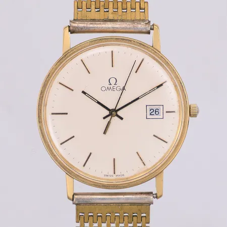 Herrur Omega 14K manuell Ø33,5mm, svag gravyr, armband i stål