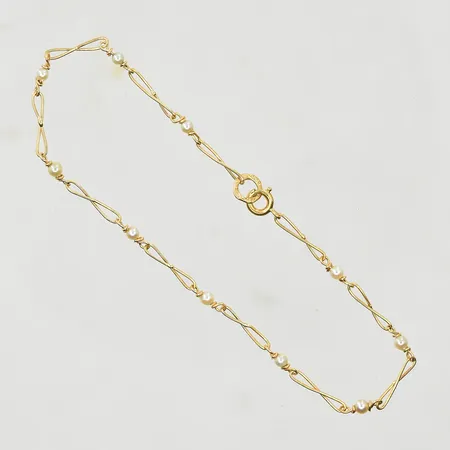 Armband med 10 odlade pärlor Ø2 mm, längd 19 cm, bredd 2 mm, 18K. Vikt: 1,6 g
