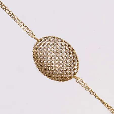 Armband med vita stenar, längd 18,5cm, bredd 1,3-14mm, 18K.  Vikt: 2,6 g