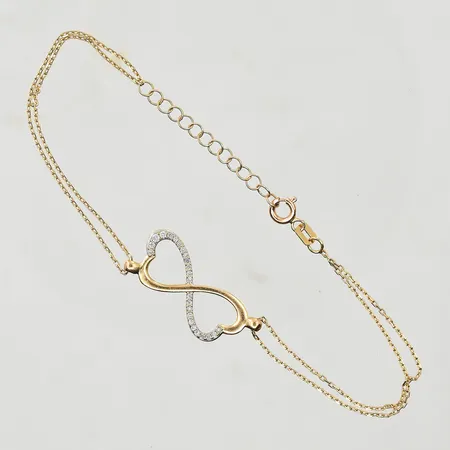 Armband med diamanter ca 0,08ctv, Glamira, längd 17-20 cm, bredd 2-11 mm, 18K. Vikt: 3,1 g