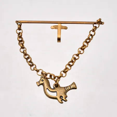 Slipsnål i brons, 5,5x7,5cm, Liten fågel, Kalevala.