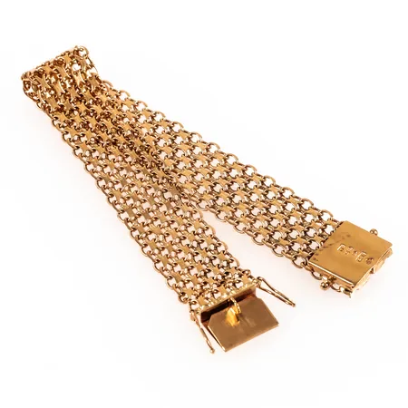 Armband X-länk i 18K guld. Det är 18,5 cm långt, 16,5 mm brett och väger 25,0g. Kistlås. Stämplad P9 (1965), ABD (Brofod AB, Falköping), 18K och kattfot.