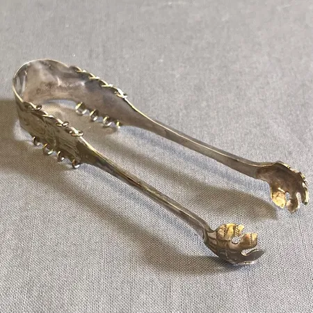 Sockertång, 9,5cm, tillverkad år 1957 av Persson Aktiebolag C O, silver  Vikt: 21 g