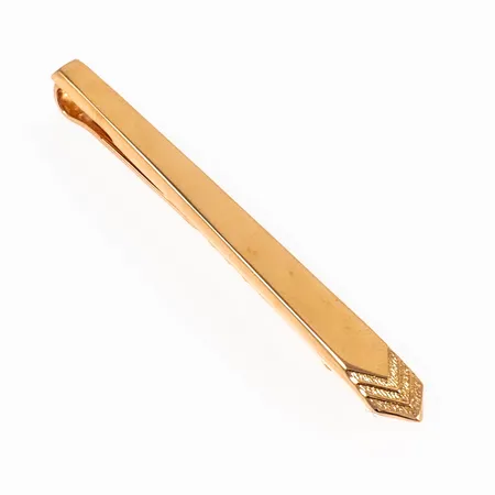 Slipsnål i 18K guld. Den är 3,5 - 6 mm bred, 51 mm lång och väger 3,0g. Stämplad N10 (1987), DE (D.Ekström Sweden AB, Falköping), 18K och kattfot.