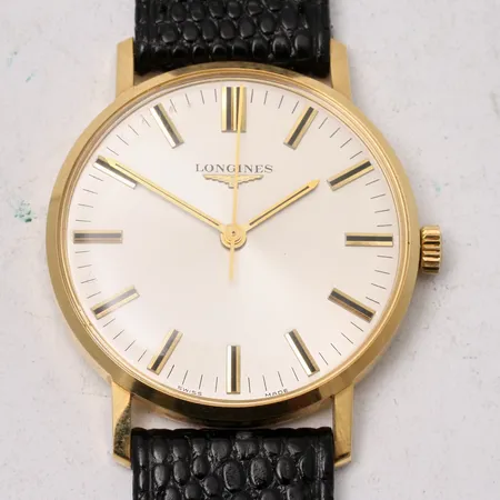 Herrur Longines i 18K guld, Ø3mm, manuell, personlig gravyr på boett, låda, läderband.