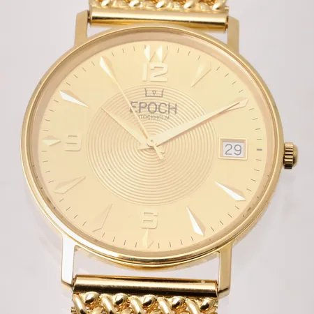 Herrur Epoch Stockholm, Ø34,5mm, quartz, datum, 18K guld, integrerad armband i 18K guld, handledmått inklusive ur ca 21cm, instruktionsbok, etui, fint skick, i behov av batteribyte, bruttovikt 73,18g, ca nettovikt 61g.