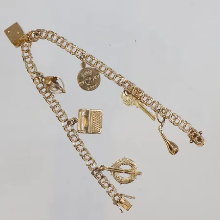 Armband Bismarck 19cm med 7 Berlocker med glas 18K Vikt: 15,7 g