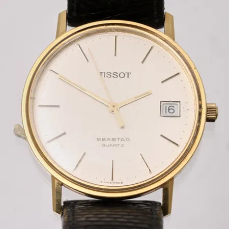 Herrur Tissot Seastar i 18K guld, Ø33mm, qvartz, datum, läderband, box.