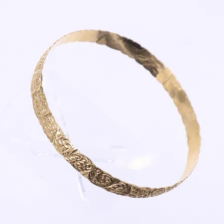 Armring med mönstrad dekor Ø68mm bredd 9mm något ojämn 18K Vikt: 15,8 g