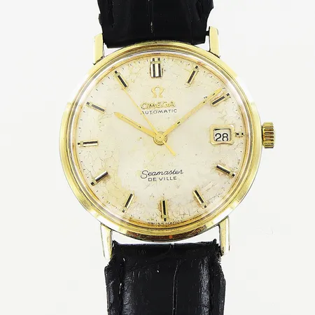 Herrur Omega Seamaster De Ville, guld på stål, automatisk, Ø34mm, fungerar ej, krackelerad urtavla, defekter på visare, uppdragskrona och läderband ej original, inga tillbehör.