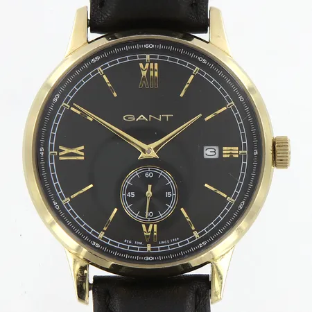 Herrur Gant referens-nr:GT023C Ø42mm, stål/gulmetall,slitet läderband med originalspänne, repor på glas