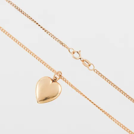 Collier med hänge 18k,längd ca 50 cm bredd 1.7 mm,hängets höjd ca 13 mm. Vikt: 6,3 g