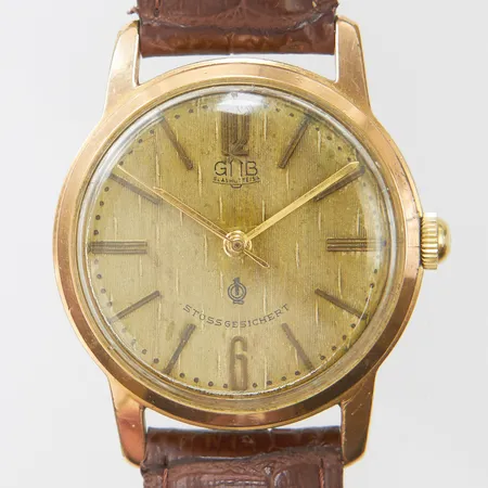 Herrur GUB Glashütte Stossgesichert, doublé, manuell, 33,5mm, boettnr 120014, brunt läderarmband, skadad urtavla, repig boett, inga tillbehör.