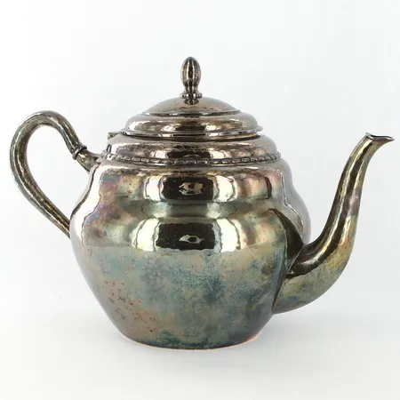 Tekanna, CG Hallberg år 1928, hamrad yta, höjd ca 16cm, vidd ca 25cm, 830/1000 Silver Vikt: 424 g