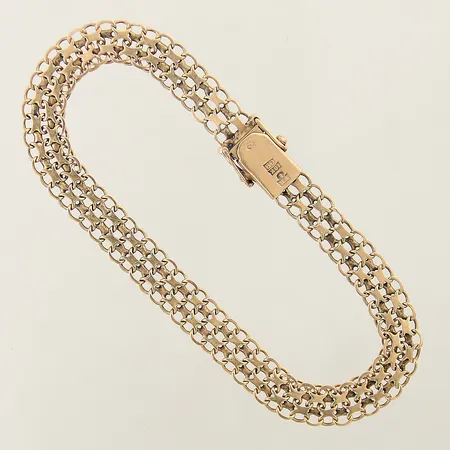 Armband X-länk längd 19,5cm bredd 7,4mm slitna länkar 18K Vikt: 10,1 g