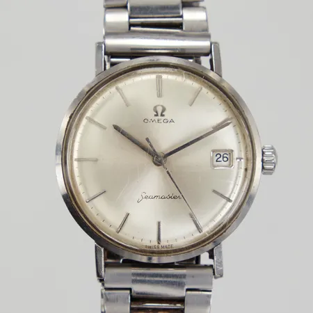 Herrur Omega Seamaster, Ø34mm, stål, manuell, datum, monocoque, stållänk med viklås, repigt plastglas, inga tillbehör.