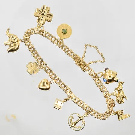 Armband Bismarck med 10 berlocker längd 18 cm, bredd 5 mm, säkerhetskedja, 18K. Vikt: 16,7 g