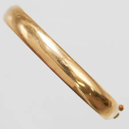 Armband stelt, öppningsbart inre omkrets 61,5mm, yttre omkrets ca 67mm, bredd 9mm, mindre repor, 14K Vikt: 11,9 g