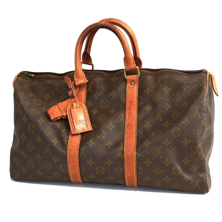 Väska Louis Vuitton Keepall 45, 70-talet, monogramcanvas, detaljer i mässing, adresstag, LV-lås saknar nyckel, en fläck insida, läder på dragkedjeflärp saknas, fläckar/slitage/defekter på läderdetaljer, en nit invändigt har släppt, viss doft, inga tillbehör