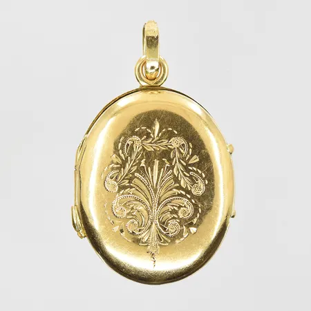 Hänge medaljong med graverat mönster öppningsbar stl:30x20 mm, glasinsatser saknas, går ej att stänga, 18K. Vikt: 2,5 g
