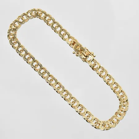 Armband Bismarck längd 19½, bredd 5 mm, slappa låsåttor, 18K. Vikt: 10,2 g