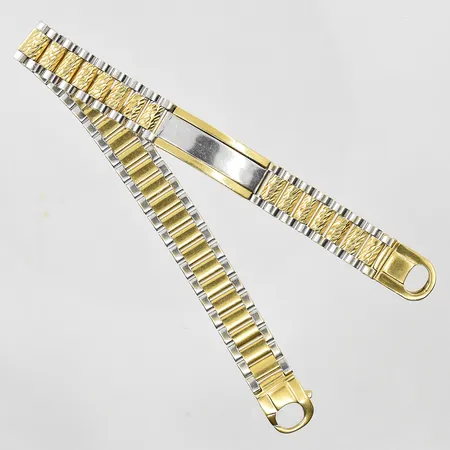 Armband med platta längd 21cm bredd 10 mm, halvstel modell, Obs ej märkesdesign, gulguld/vitguld, 18K. Vikt: 30,8 g