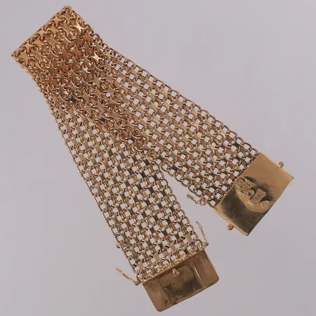 Armband X-länk, längd 19,5cm bredd 23,3mm, trögt lås och låsåtta, del av säkerhetskedja kvar. 18K Vikt: 43,1 g